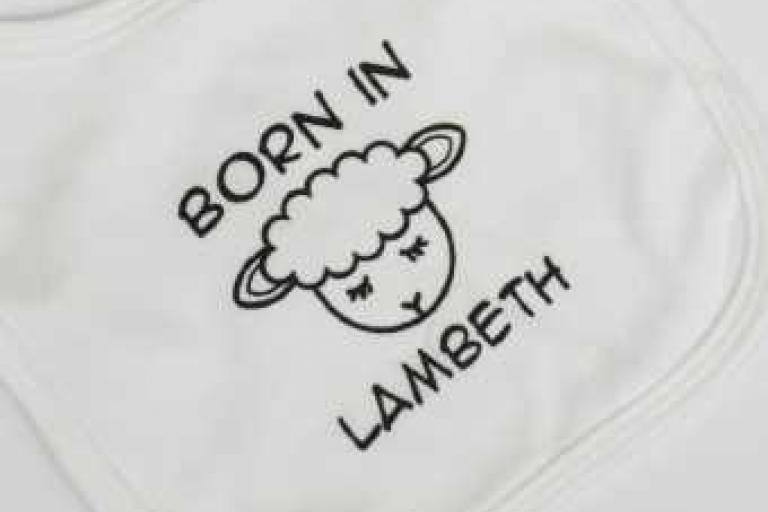 Born in Lambeth undated lamb bib in white - close up