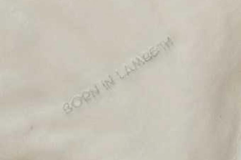 Born in Lambeth undated comforter with silver lettering - close up