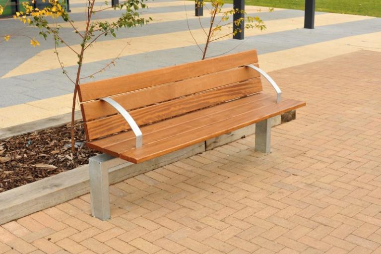 photo of a willenhall style memorial bench with pine slats and steel arms