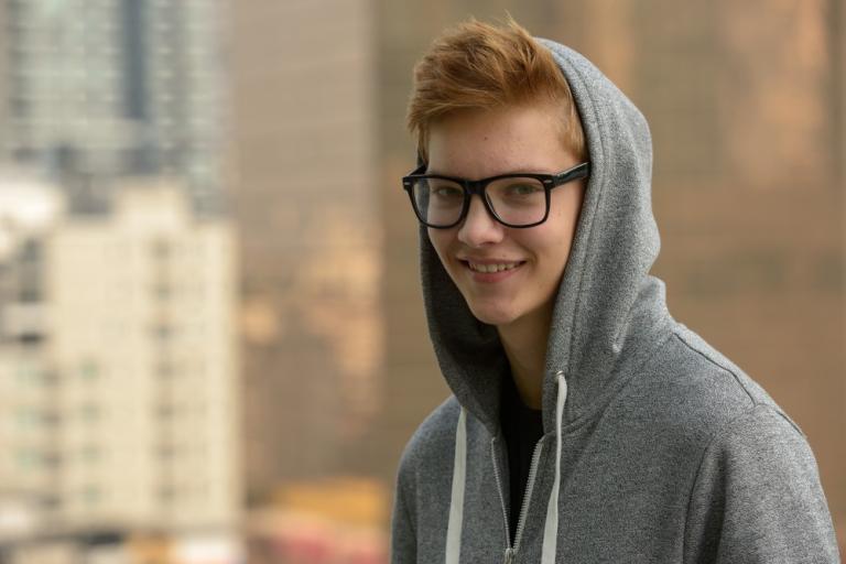 photo of teenager wearing glasses