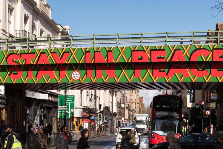 Stay in peace bridge mural on Brixton Road railway bridge