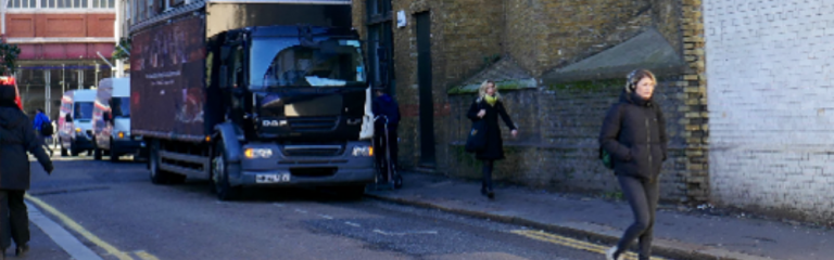 Lorry parked up in sandell street as people walk by