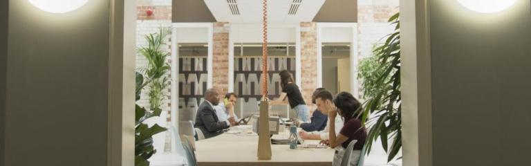 People working at desks in the Tripod workspace 