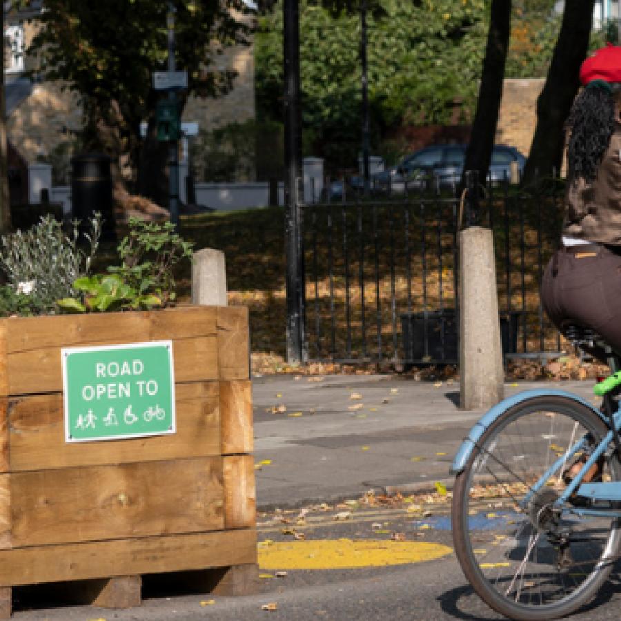 Lady cycling in lower traffic neighbourhood