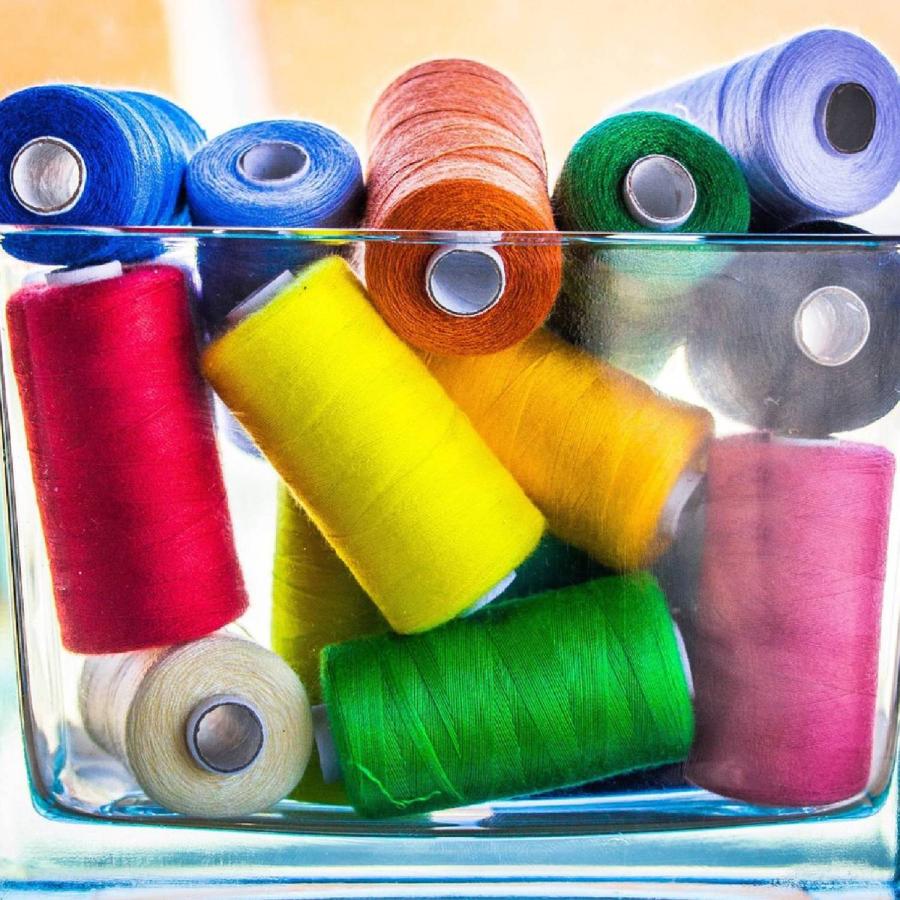 various sewing threads displayed in a bowl