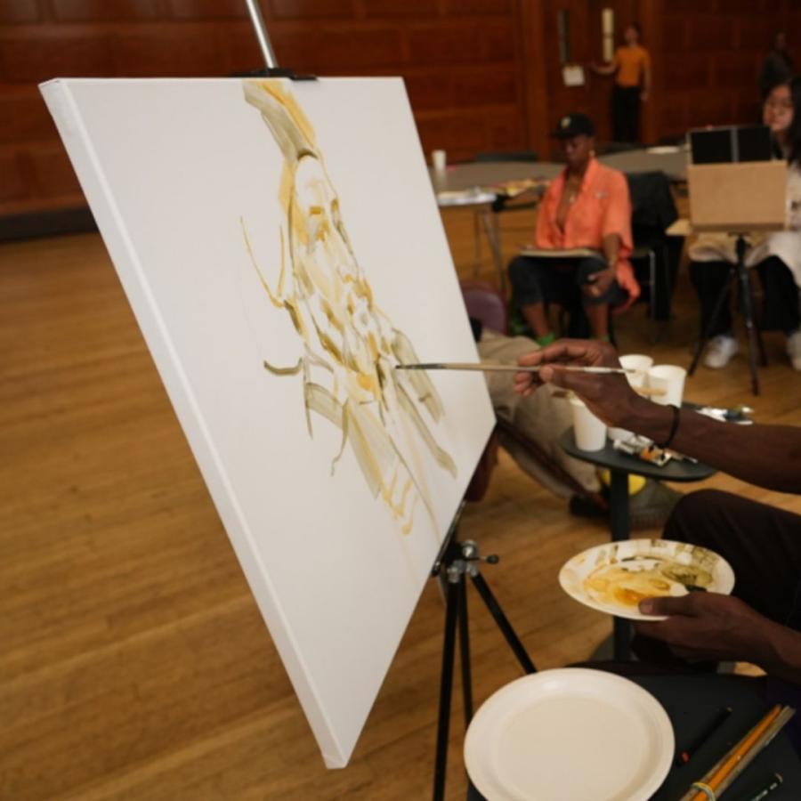 ease; with outlines of a portrait (left) - painter Alvin Kofi in shadows )right)