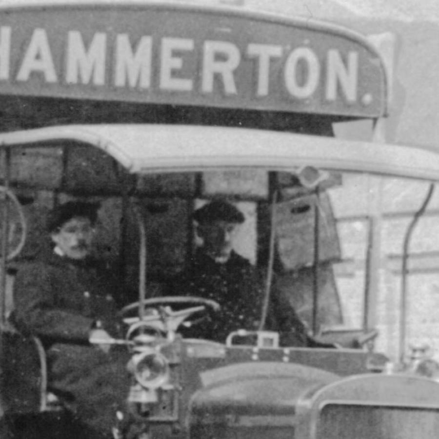 a photo of men driving a lorry