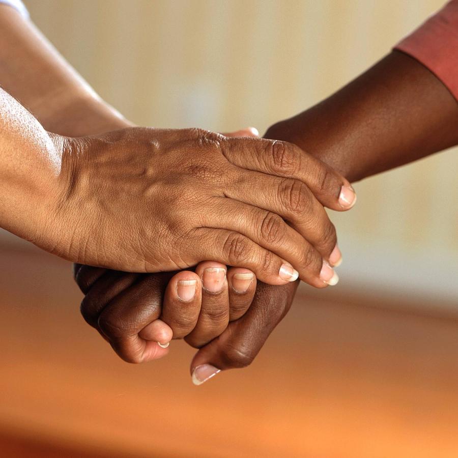 a photo of two people holding hands