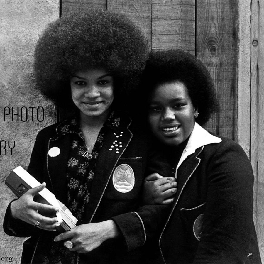 two beautiful black ladies posing for a snap