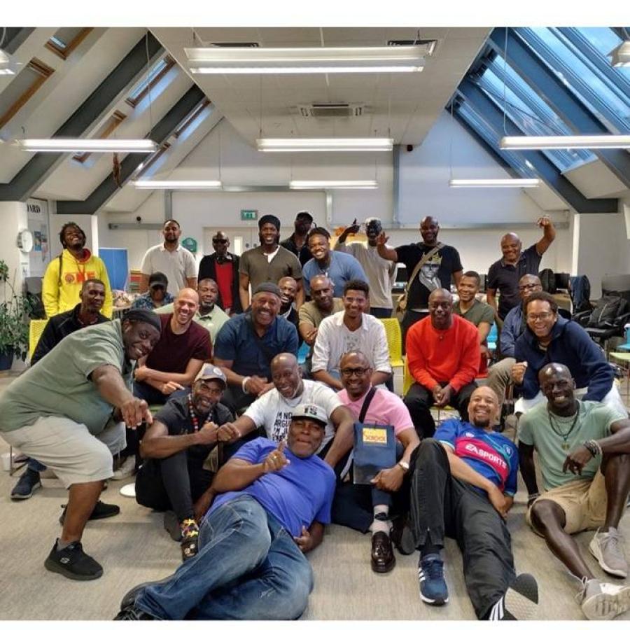 Various black men posing for the camera