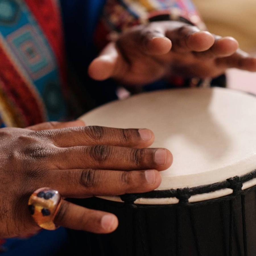 a snapshot of someone playing the drum