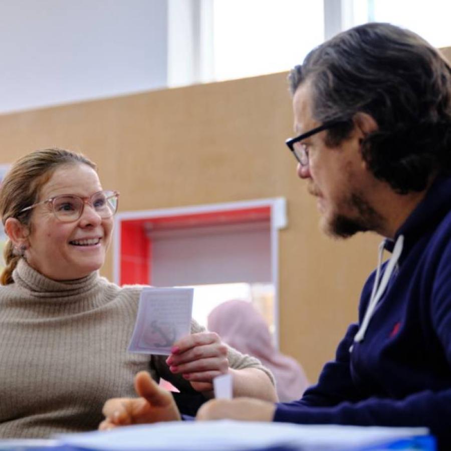 a snapshot of a man and woman chatting