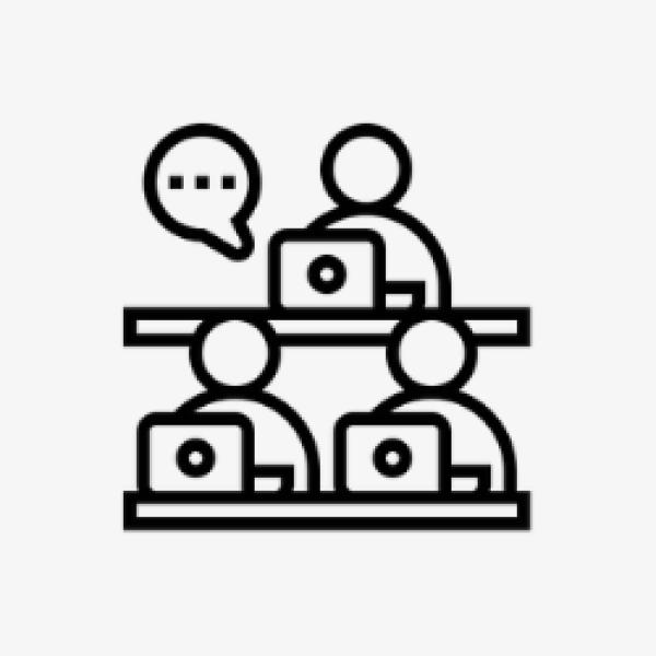 Icon of people sat at desks with laptops